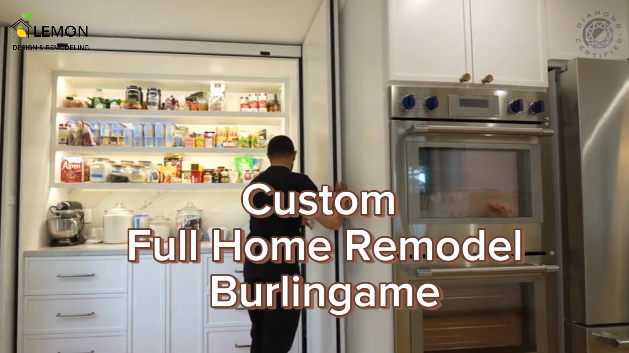 Completed luxury open-concept kitchen remodel in Burlingame featuring custom quartzite stone countertops, handmade cabinets, and Thermador stainless steel appliances by Lemon Remodeling.