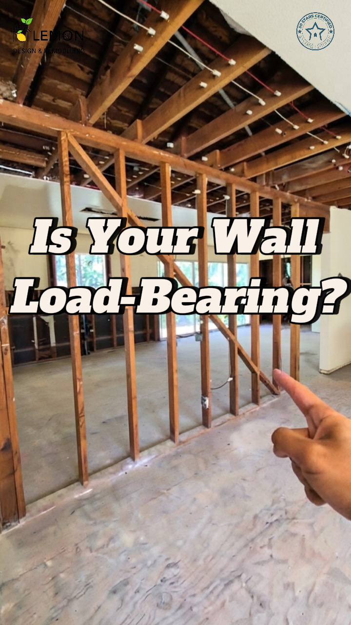 Contractor pointing at exposed interior wood framing studs and ceiling joists to explain how to identify a load bearing wall during a home remodel by Lemon Remodeling.